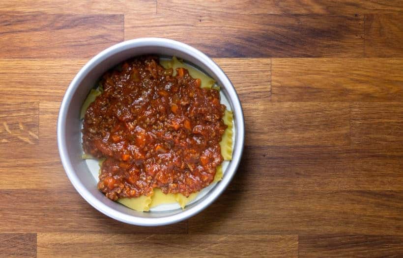 Instant Pot Lasagna: layer lasagna noodles and sauce in springform pan