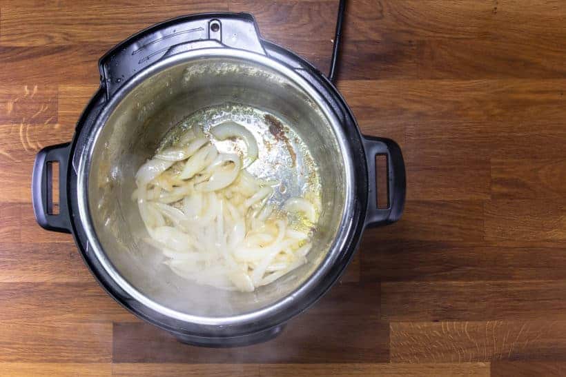 Instant Pot Butter Chicken: saute onions in Instant Pot Pressure Cooker